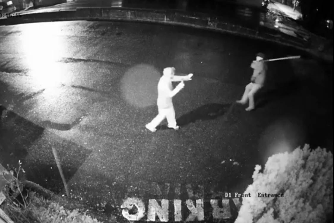 A still from security camera footage from an apartment building on Prideaux Street, in Nanaimo, portrays an alleged attack by a man brandishing a pole Wednesday. The victim said he suffered a concussion and damage to his cell phone. (Photo submitted)