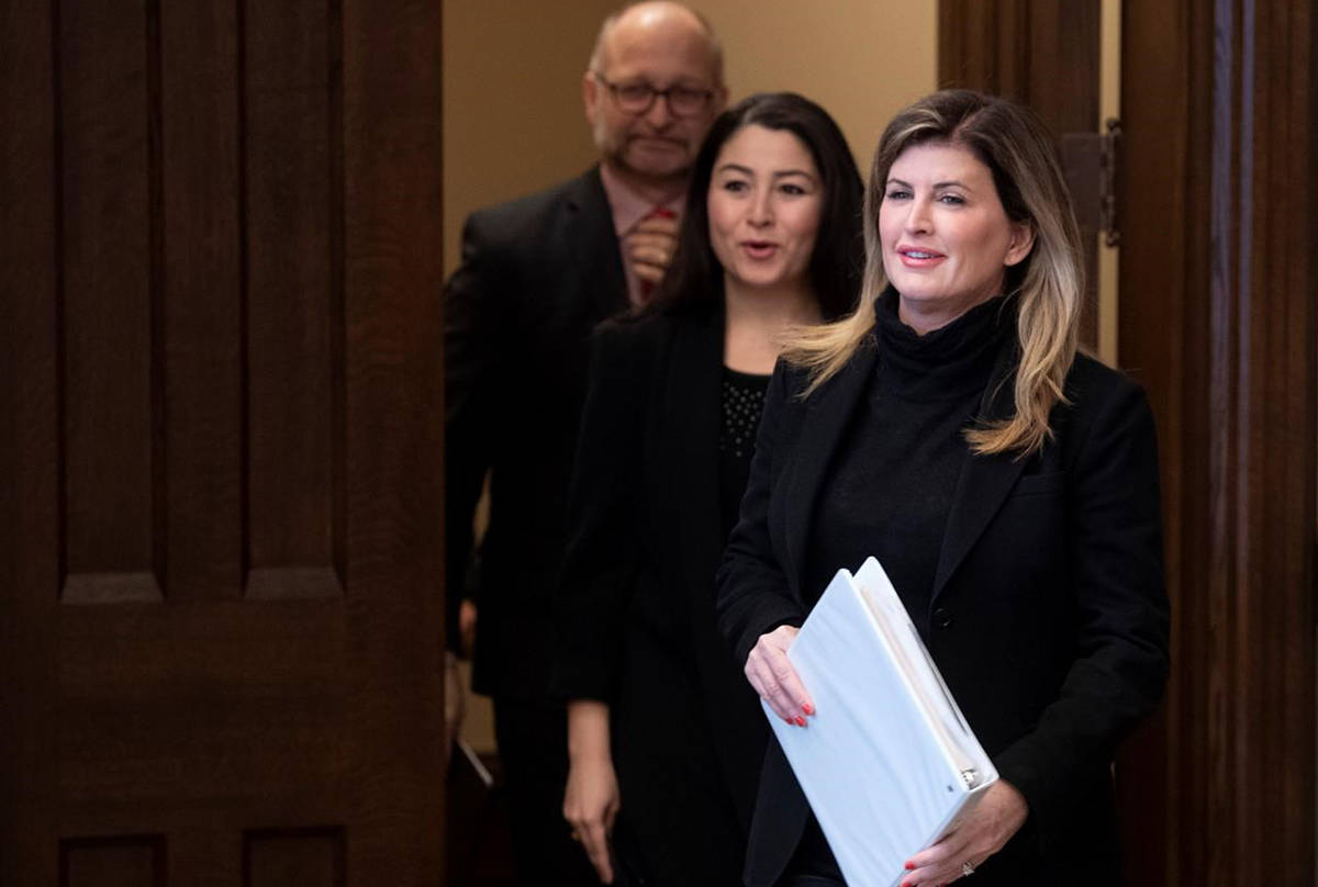 Rona Ambrose, Women and Gender Equality and Rural Economic Development Minister Maryam Monsef and Minister of Justice and Attorney General of Canada David Lametti make their way to speak in the Foyer of the House of Commons in Ottawa, Tuesday February 4, 2020. THE CANADIAN PRESS/Adrian Wyld