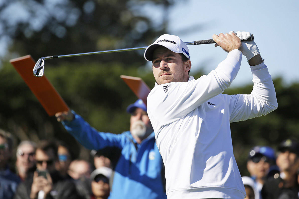 Nick Taylor of Abbotsford follows his shot from the fourth tee of the Pebble Beach Golf Links during the final round of the AT&T Pebble Beach National Pro-Am golf tournament Sunday, Feb. 9, 2020, in Pebble Beach, Calif. (AP Photo/Eric Risberg)