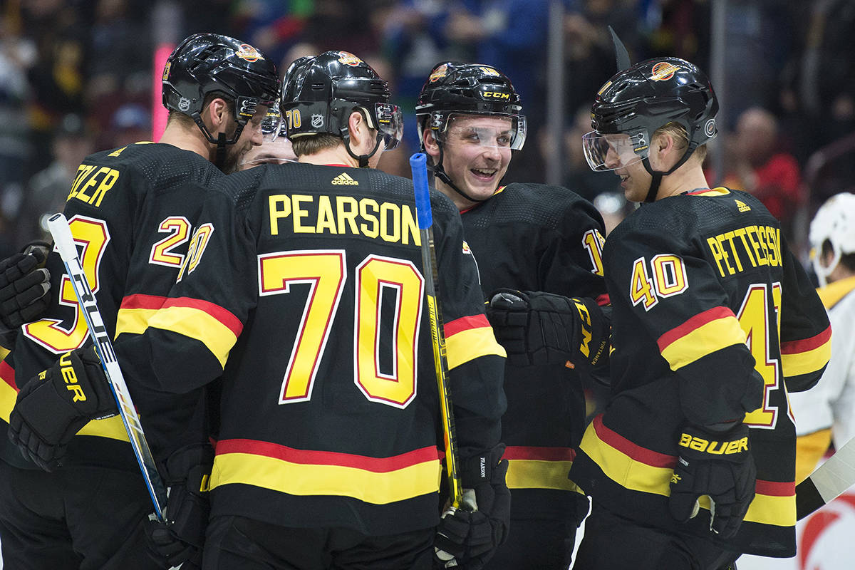 Vancouver Canucks centre Elias Pettersson (40) celebrates his goal with his teammates during second period NHL action in Vancouver, Monday, February 10, 2020. THE CANADIAN PRESS/Jonathan Hayward