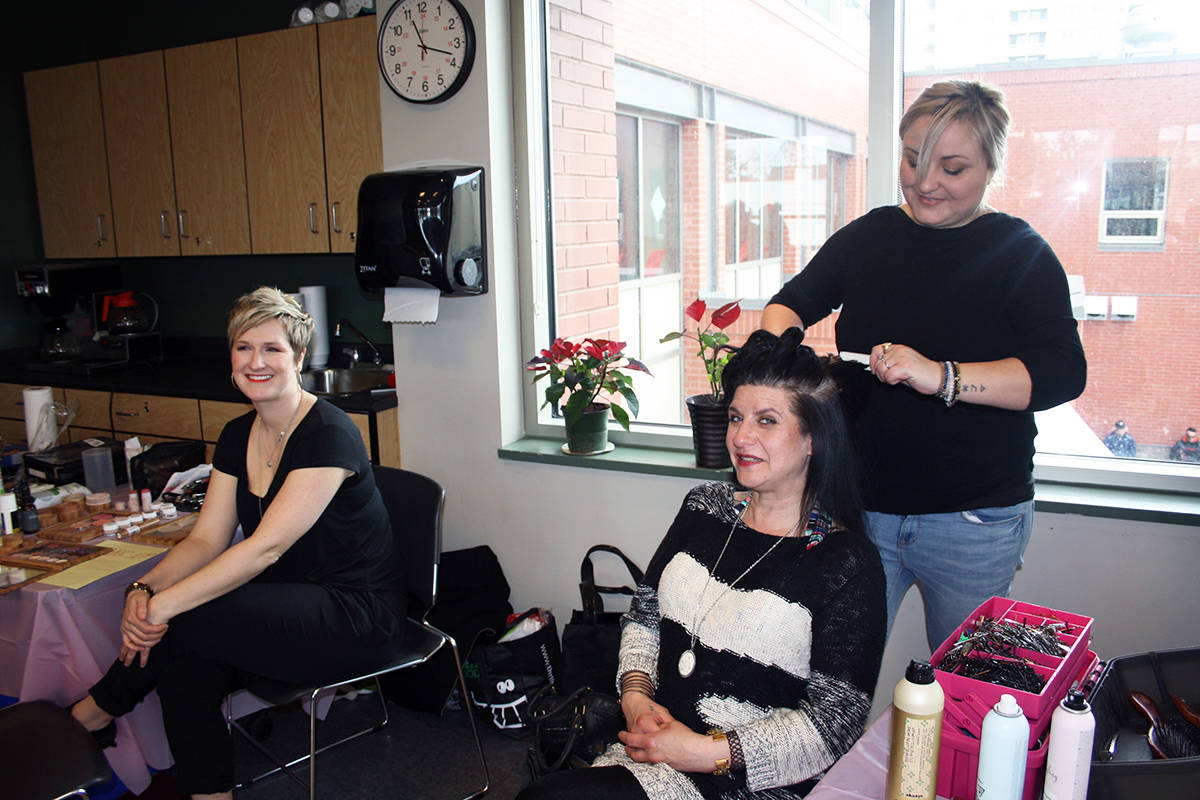 Nina Despins has her hair done by volunteer hairdresser, Mandy Rogers as make-up artist, Erin Bradley, looks on during Our Place’s annual Beauty Day. (Black Press Media file photo)