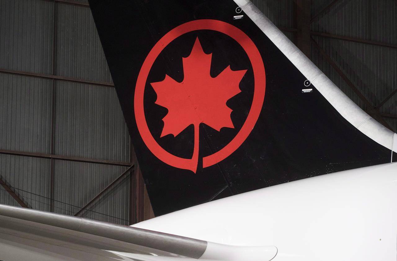 The tail of the newly revealed Air Canada Boeing 787-8 Dreamliner aircraft is seen at a hangar at the Toronto Pearson International Airport in Mississauga, Ont., on February 9, 2017. THE CANADIAN PRESS/Mark Blinch