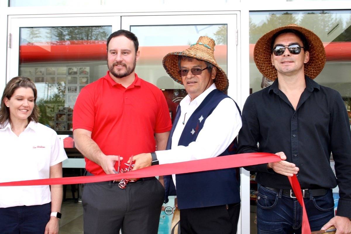 Chief Gordon Planes (third from left) joins representatives of Petro Canada and Tim Horton’s and Band Council member Allan Planes for the official ribbon cutting at Sooke’s first Tim Horton’s. The development is now the subject of suits and counter suits related to the non-payment of sub-contractors on the project. (Tim Collins -Sooke News Mirror)