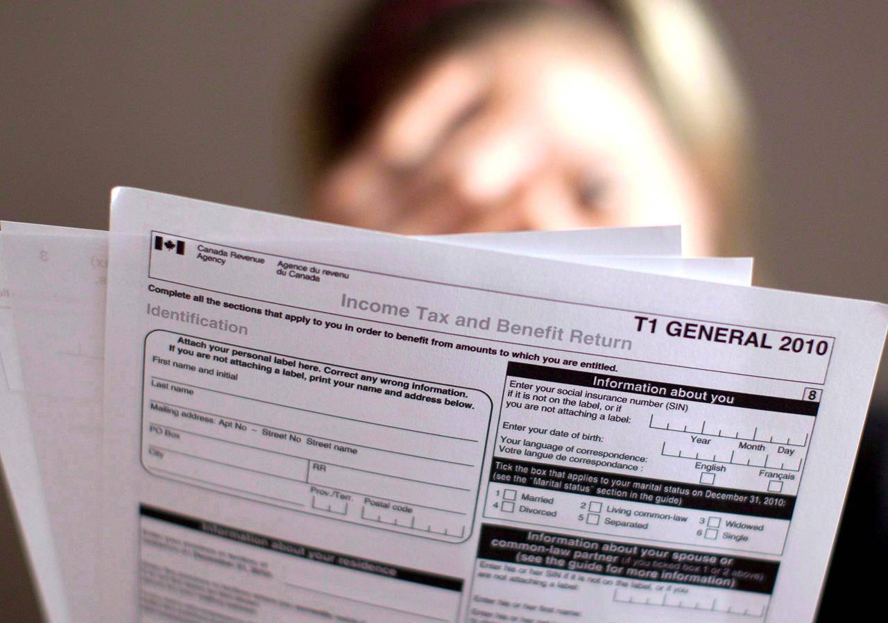 A tax return form is pictured in Toronto on Wednesday April 13, 2011. The Canada Revenue Agency is sending an unlikely message to kick off tax season: Paper-filers, we have not forgotten you. Despite a years-long push to have more people file taxes online because it’s generally faster and easier, many Canadians still prefer putting pen, or pencil, to paper. THE CANADIAN PRESS/Chris Young