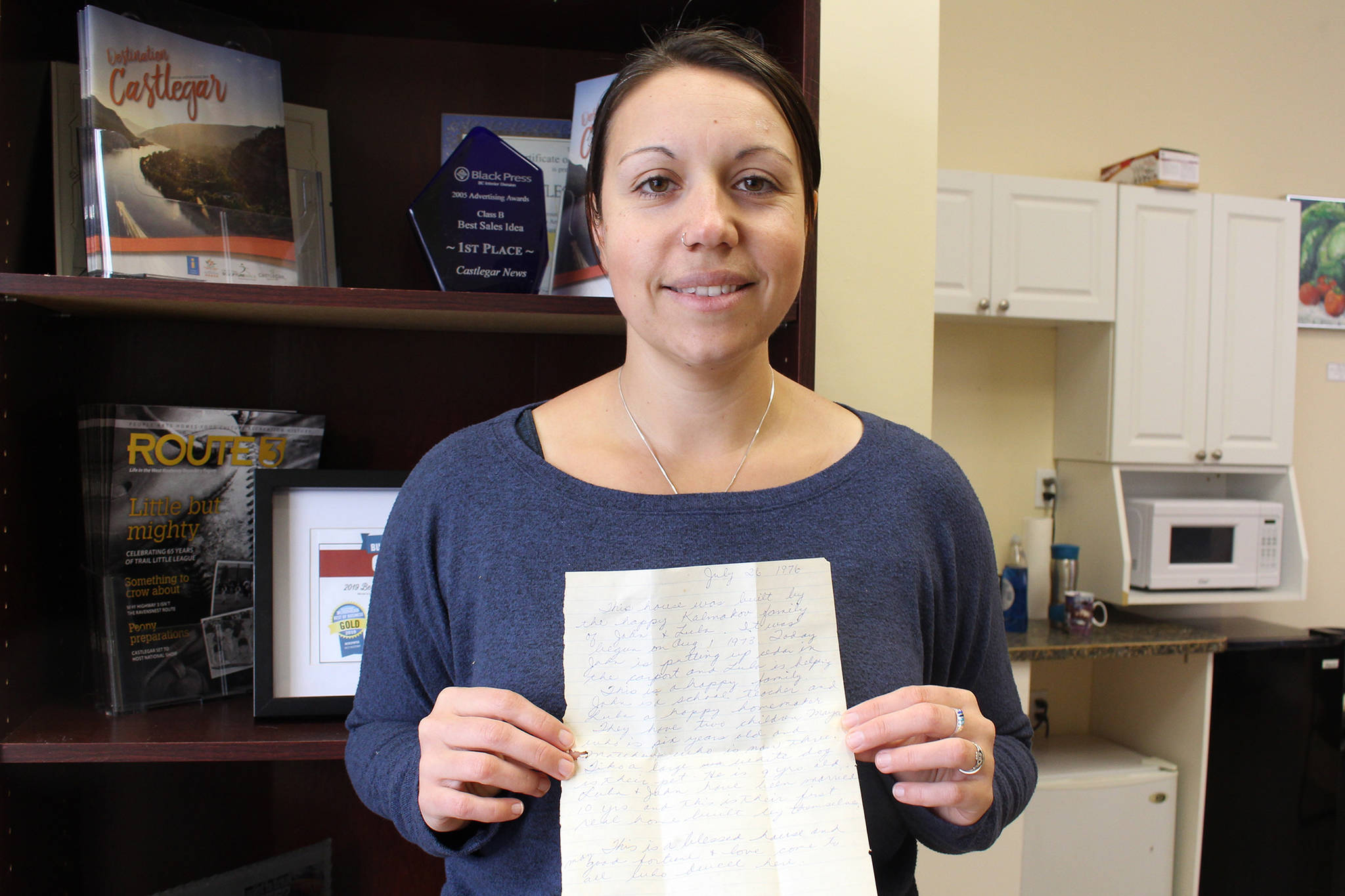 Fanny Rodgers shows a 45-year-old message left in the walls of her Castlegar home.                                 Photo: John Boivin