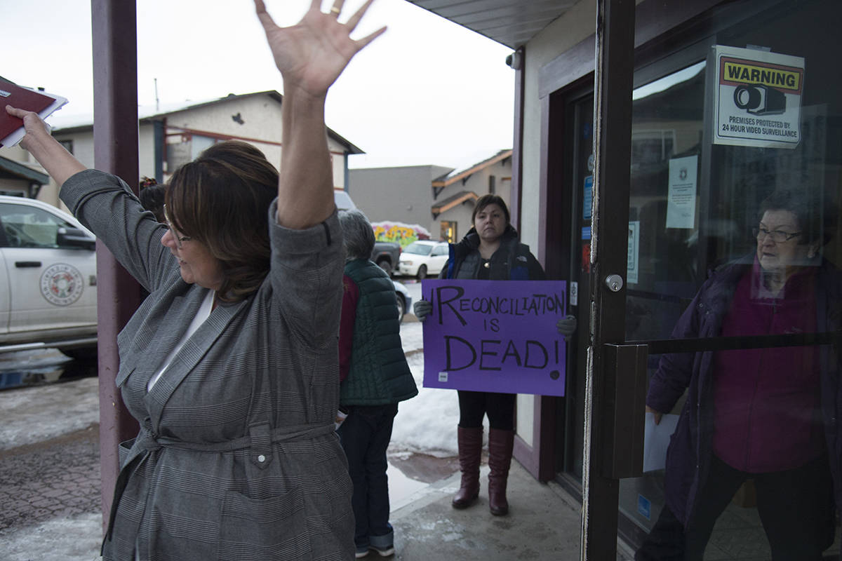 Wet’suwet’en member Bonnie George raises her arms as she leave talks with Minister of Crown-Indigenous Relation, Carolyn Bennett and the Wet’suwet’en hereditary chiefs in Smithers, B.C., Thursday, February 27, 2020. All sides where meeting to discuss the ending blockades happening across the country. The blockades are set up by those opposed to the LNG pipeline in northern British Columbia. THE CANADIAN PRESS/Jonathan Hayward
