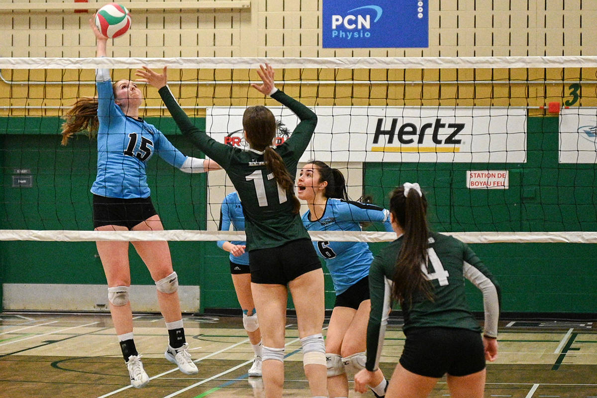 VIU Mariners player Shelby Dorman-Banks goes for a kill as teammate Amanda Dobbyn watches the outcome during Saturday’s CCAA gold-medal match against the Élans de Garneau in Quebec. (Canadian Collegiate Athletic Association photo)
