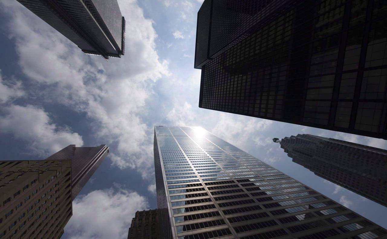 The Canadian flag blows in the wind in the heart of the financial district in Toronto on June 27, 2018. HSBC Bank Canada says it will lower its prime lending rate by 50 basis points effective tomorrow. The bank says in a statement the rate will be 2.95 per cent — down from 3.45 per cent. The move matches action by several Canadian banks and financial institutions Monday. THE CANADIAN PRESS/Tijana Martin