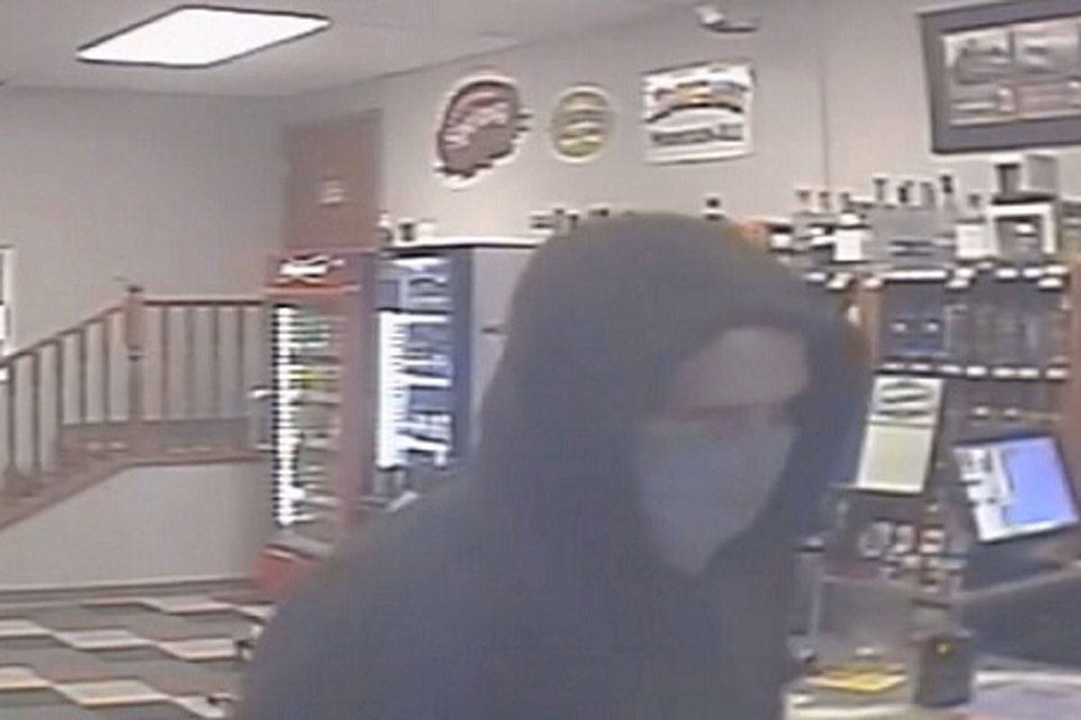 West Shore RCMP is investigating a robbery that took place at Ma Miller’s Pub in Langford on March 23. The suspect is a man who concealed his face and left in a dark-coloured sedan. (Courtesy of West Shore RCMP)