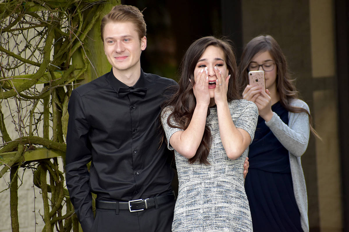 Young Abbotsford couple Skylar Bartel and Alayna Tam were surprised by friends and family in a car parade shortly after being married in a small ceremony on Wednesday afternoon. (Ben Lypka/Abbotsford News)
