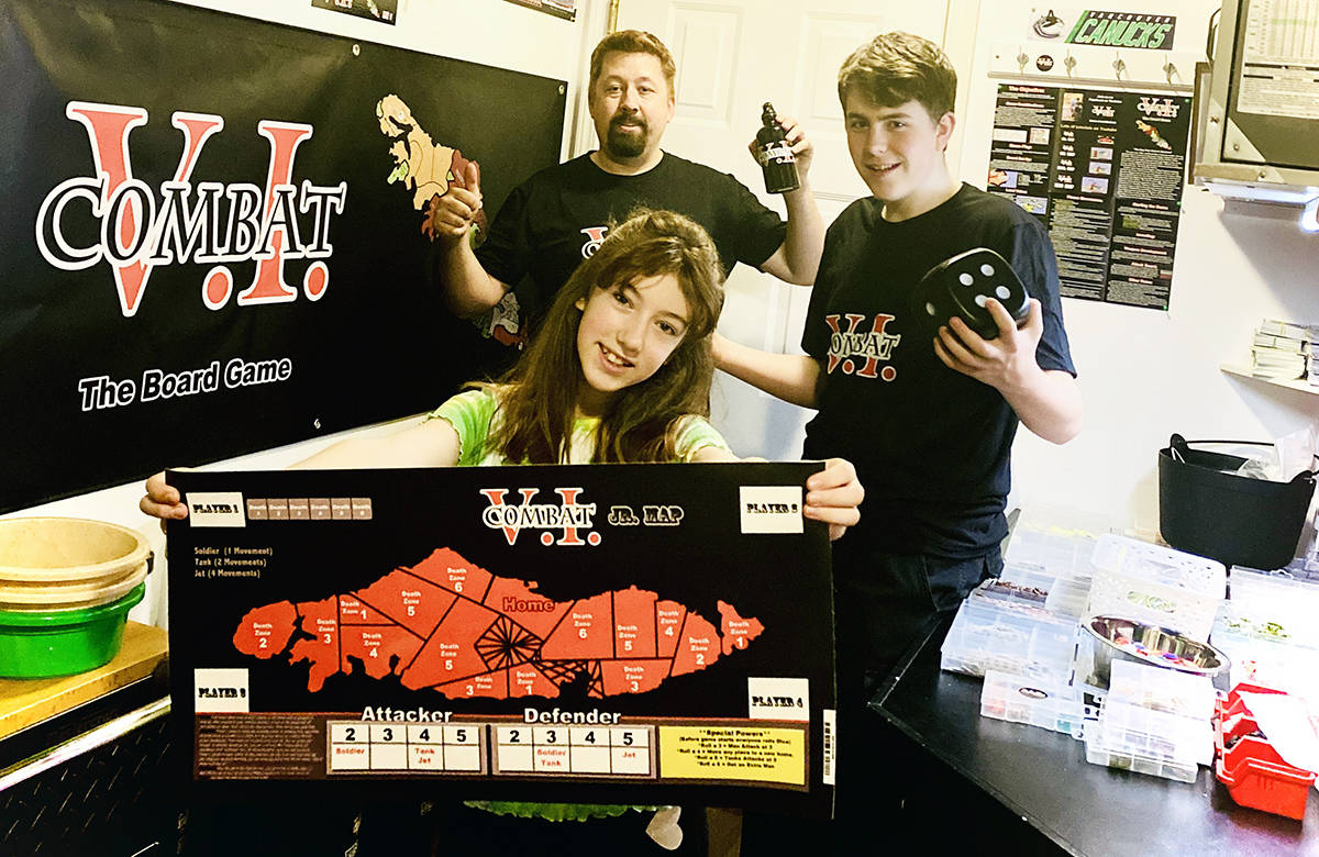 The Parks family of Crofton doesn’t get bored. They simply pull out the V.I. Combat game board, displayed by Zoey, front, and then Zebb, right, and dad Darryl, back, are all ready for action. (Photo submitted)