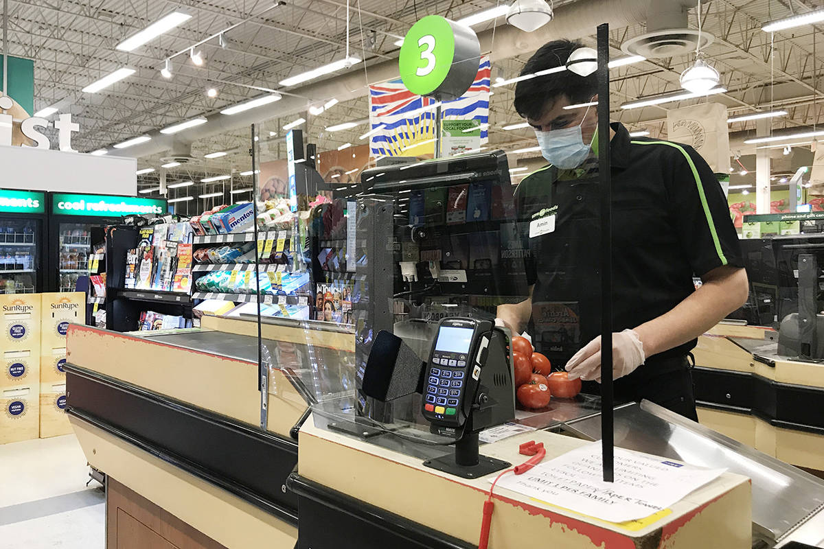 A Plexiglass barrier is pictured creating a barrier to protect a cashier at a grocery store in North Vancouver, B.C. Sunday, March 22, 2020. THE CANADIAN PRESS/Jonathan Hayward