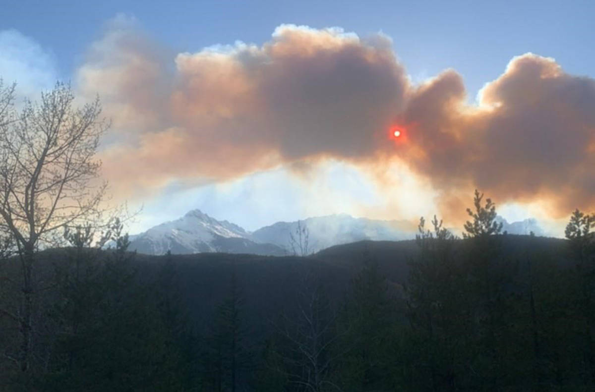 Smoke from a slash fire is seen near Squamish, B.C. on Wednesday, April 15, 2020 in this Squamish RCMP photo posted on their Twitter account. RCMP say a slash fire is burning out of control north of Squamish, British Columbia, prompting local evacuations. Mounties say the fire has started moving up the Squamish Valley. (Squamish RCMP photo)