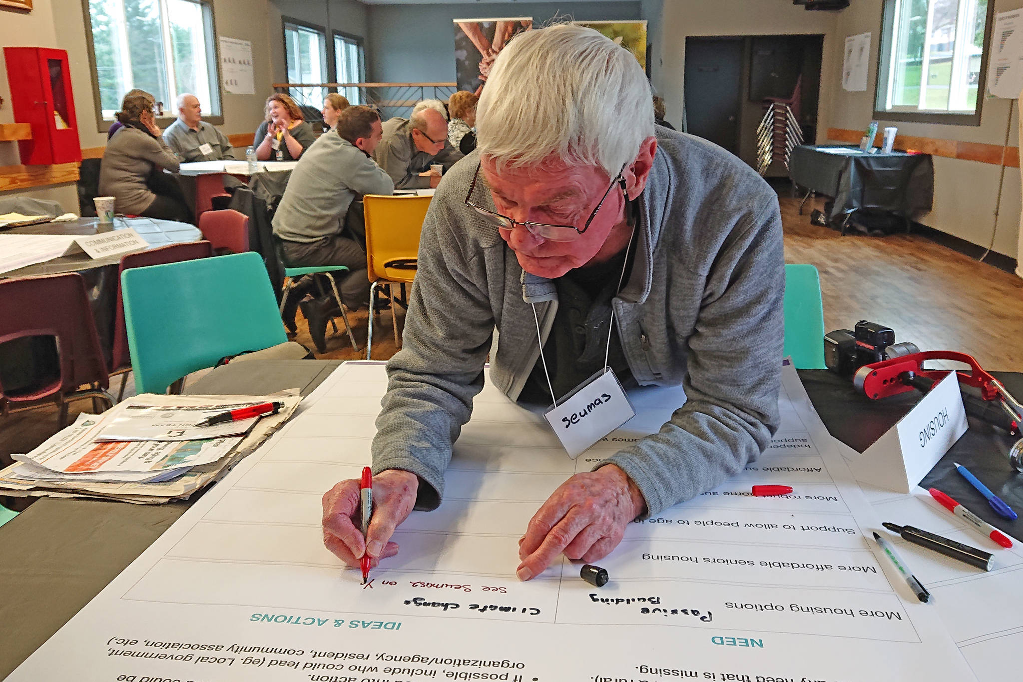 Seumas McCombie jots down housing ideas during a recent ACRD age-friendly workshop (MIKE YOUDS/ Special to the AV News)