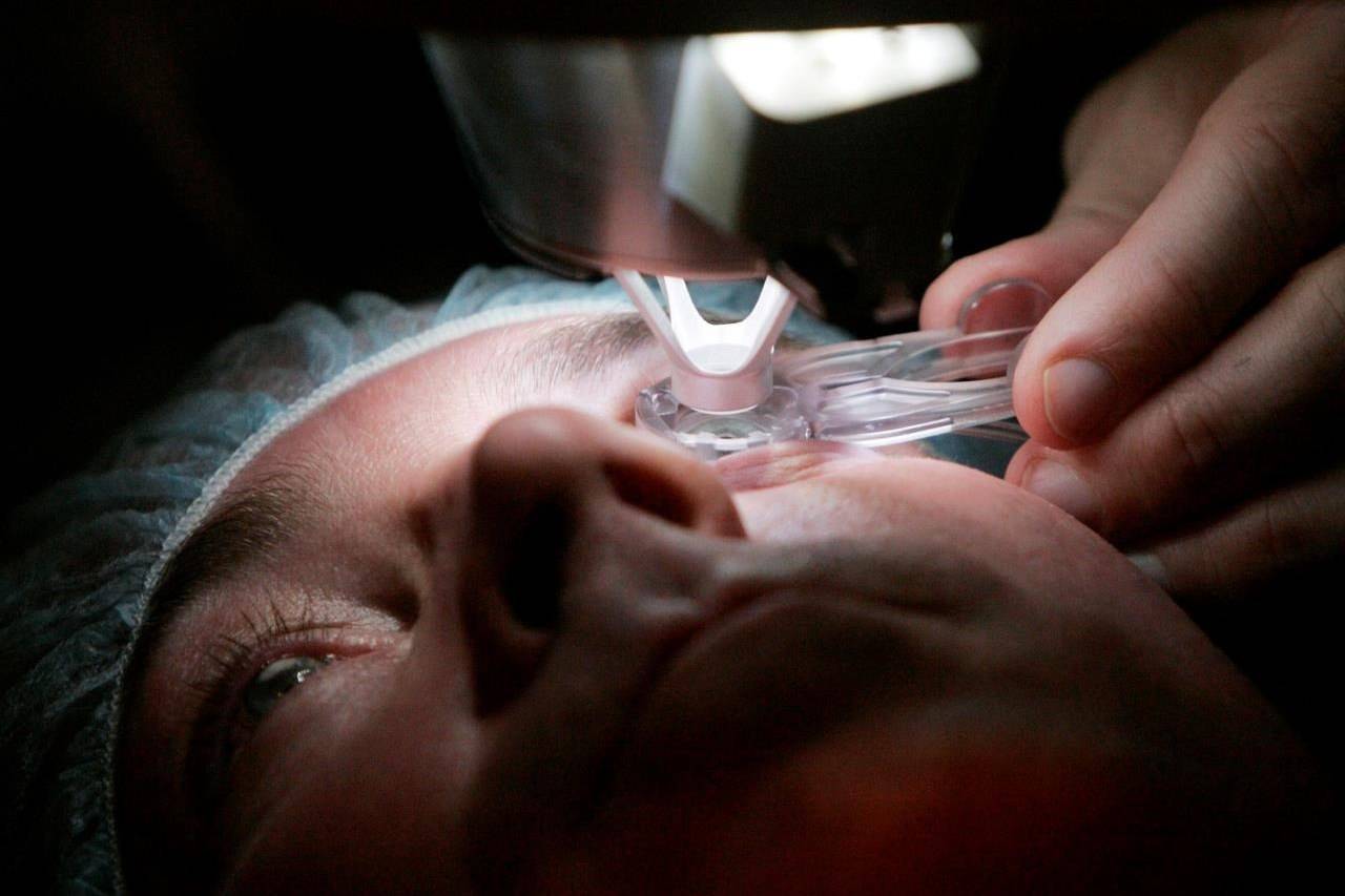 In this Nov. 1, 2005 file photo, a doctor prepares a patient for eye surgery in Chicago. Doctors say they’re becoming increasingly concerned about how they’re going to handle the swelling backlog of elective surgeries once the immediate COVID-19 threat has ebbed.THE CANADIAN PRESS/AP/Charles Rex Arbogast