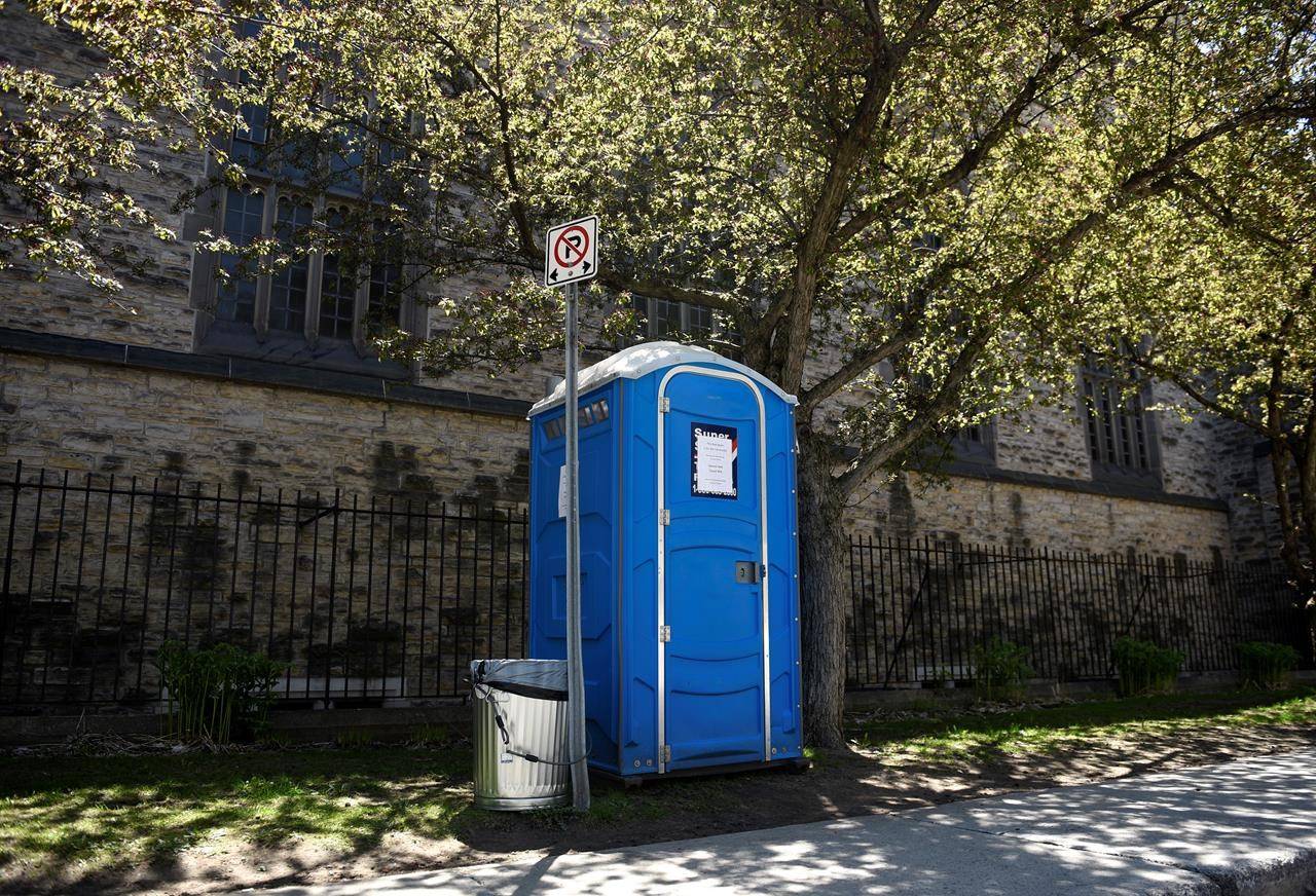 A porta-pottie beside Knox Presbyterian Church in downtown Ottawa, placed to allow people including those who are homeless or precariously housed to access a washroom, is seen on Wednesday, May 20, 2020 during the COVID-19 pandemic. THE CANADIAN PRESS/Justin Tang