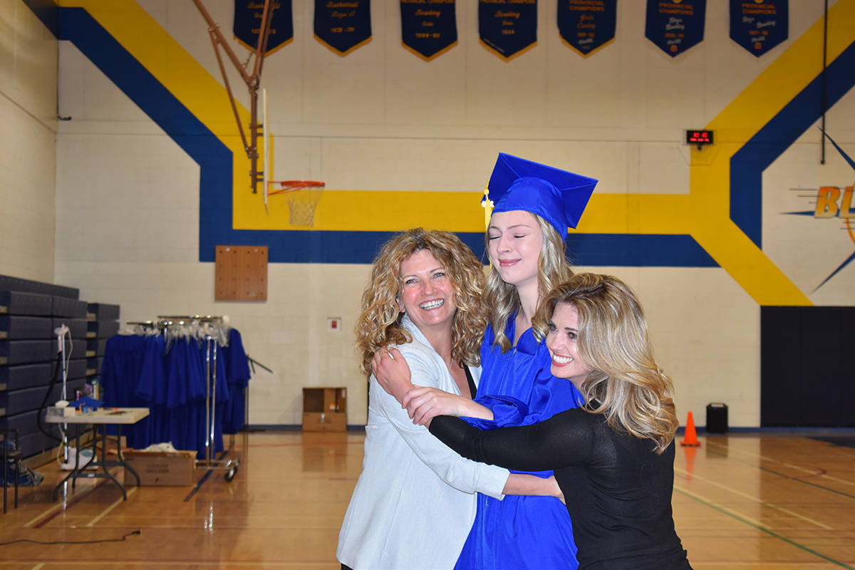 Cami Kepke (right), Allison Kepke (left), Jordan Dortman (centre) celebrate together at Prince Charles Secondary School (Photo: Robert Wisla)