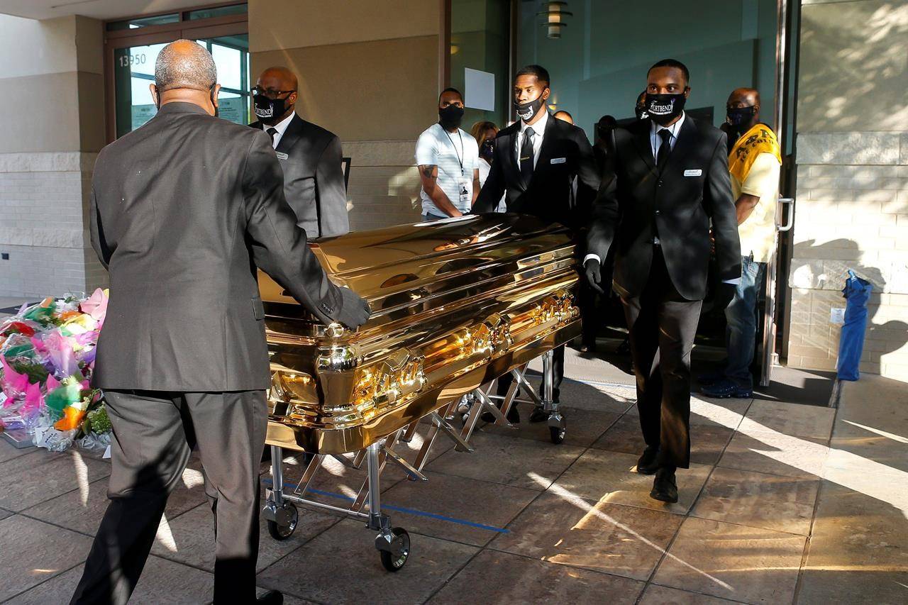 George Floyd’s casket is brought out of Fountain of Praise church following a public visitation Monday, June 8, 2020, in Houston. Floyd died May 25 after being restrained by Minneapolis police officers. (Godofredo A. Vásquez/Houston Chronicle via AP, Pool)