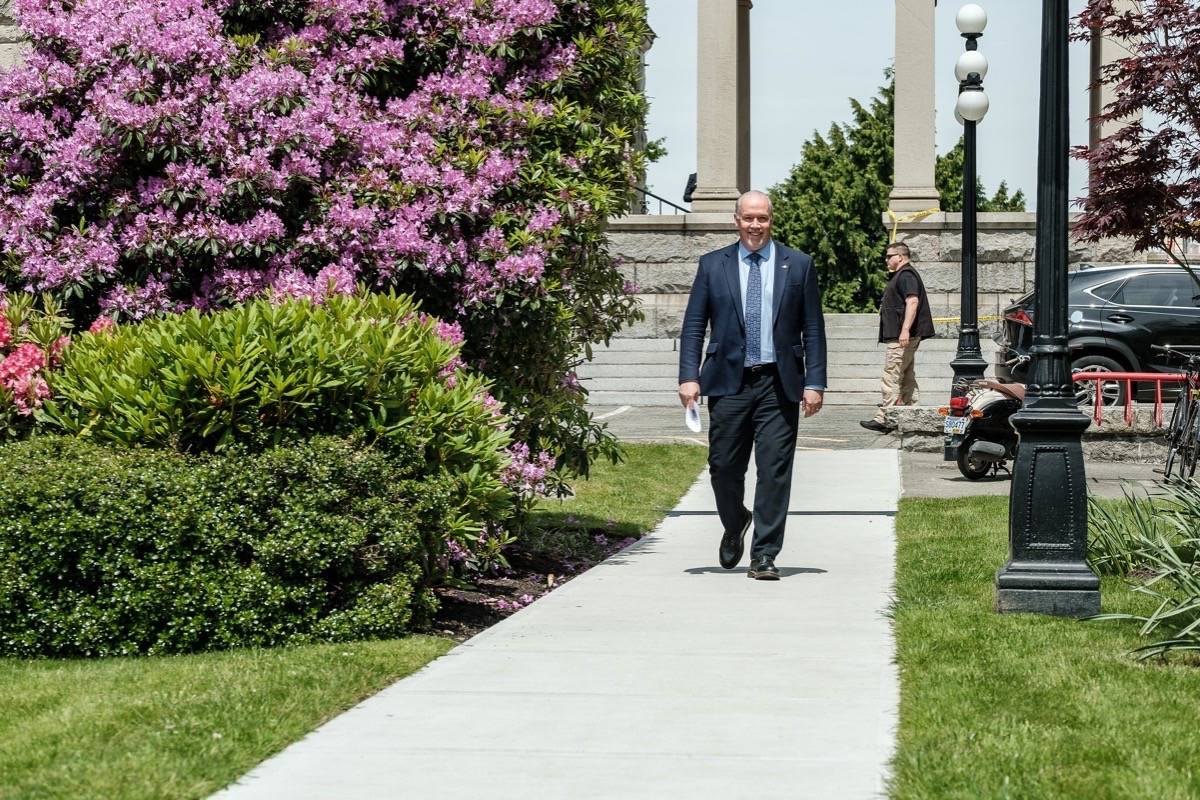B.C. Premier John Horgan walks through the rose garden at the B.C. legislature, June 3, 2020. (B.C. government)