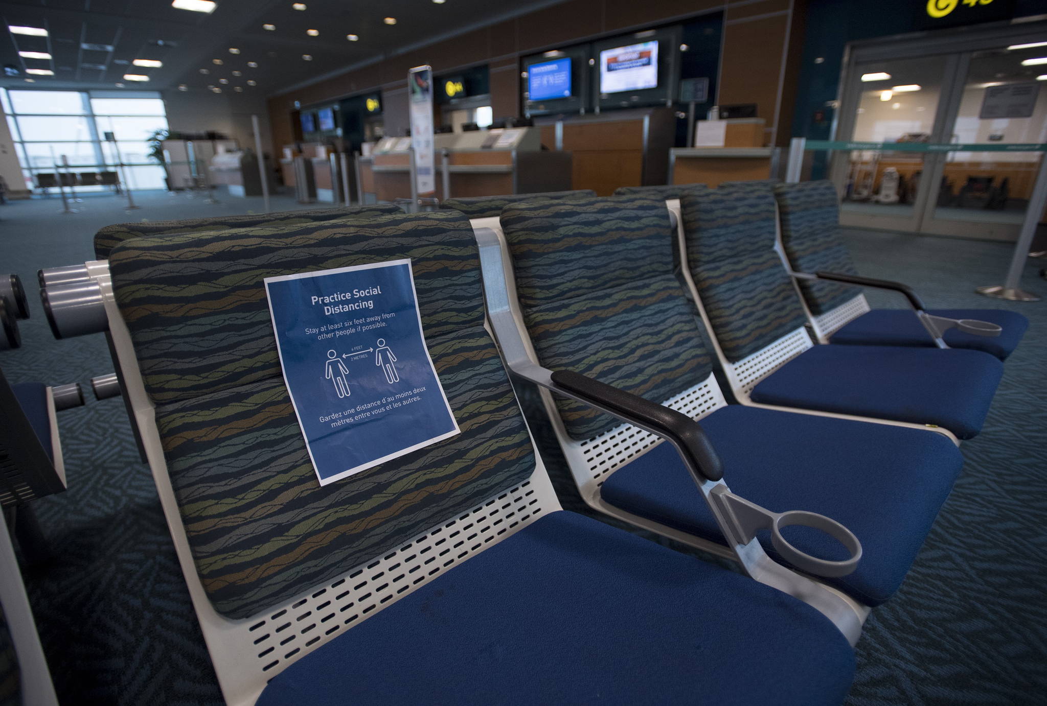 Near empty waiting areas at the flight gates are pictured at Vancouver International Airport, Tuesday, June 9, 2020. Airlines in Canada and around the world are suffering financially due to the lack of travel and travel bans due to COVID-19. THE CANADIAN PRESS/Jonathan Hayward