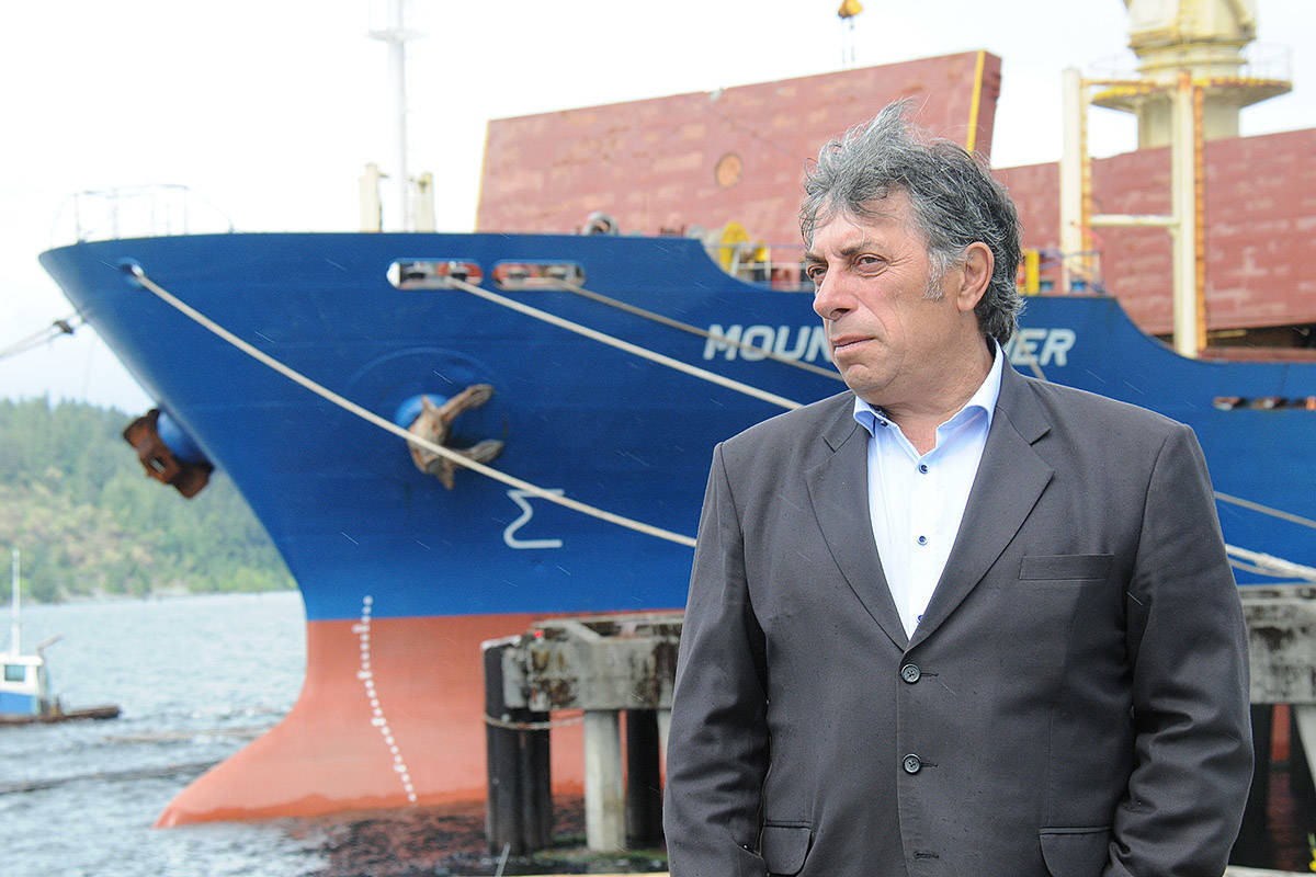 Port Alberni Port Authority president and CEO Zoran Knezevic watches the post-COVID-19 action at the dock. With one ship at the terminal, a barge and another ship were waiting their turn a little further down the Alberni Inlet. (SUSAN QUINN/ Alberni Valley News)