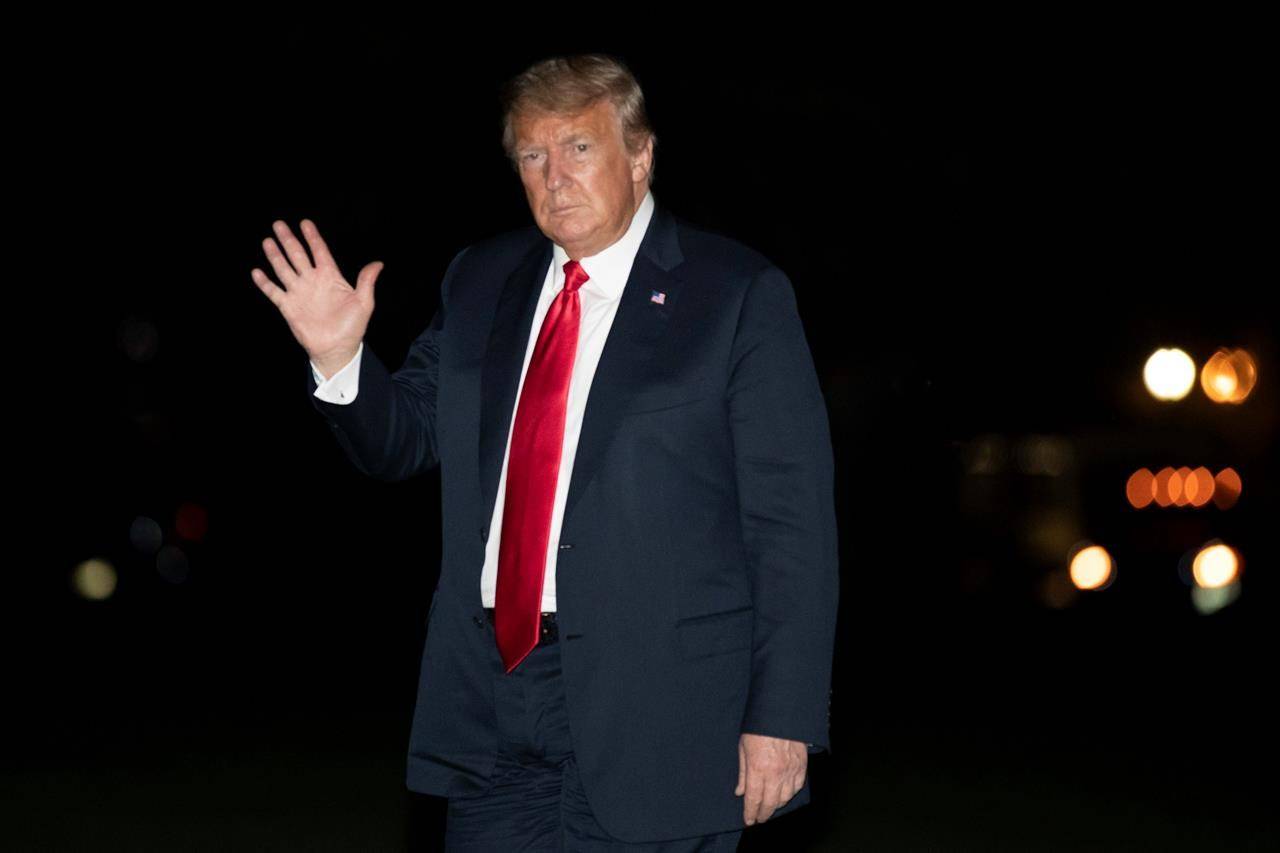 President Donald Trump waves as he walks on the South Lawn of the White House after returning on Marine One, early Wednesday, June 24, 2020, in Washington. Trump returned from Arizona. (AP Photo/Alex Brandon)
