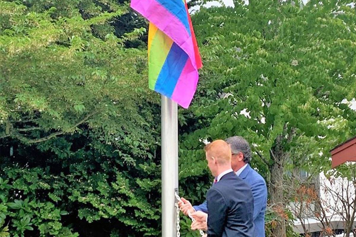 Qualicum Beach Coun. Robert Filmer and Mayor Brian Wiese at the flag-raising ceremony for Pride Week on June 23. (Submitted photo)