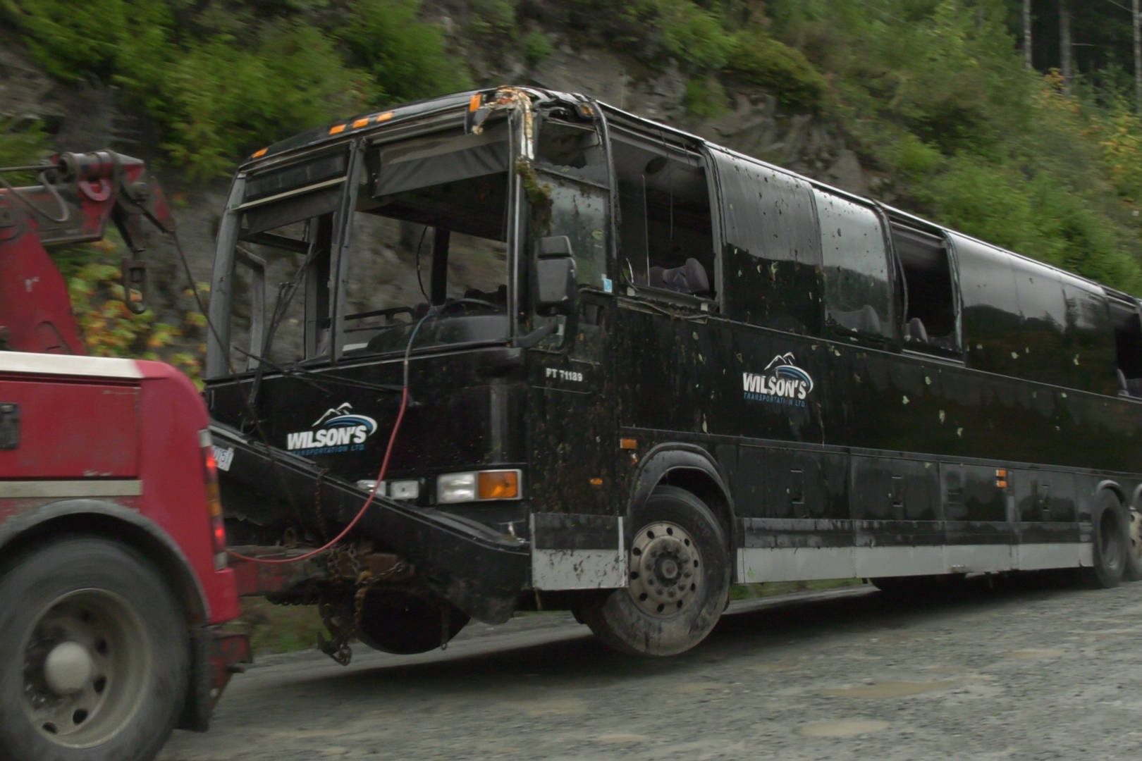 The bus involved in a crash on Bamfield Road on Friday, Sept. 13 is towed away from the scene. PHOTO COURTESY CTV NEWS VANCOUVER ISLAND