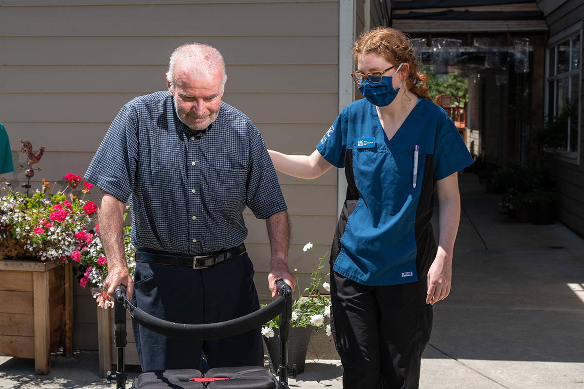 Breanna Patterson assists a client at Evergreen Seniors Home in Campbell River as part of her practicum hours in the Practical Nursing program at North Island College. Image provided