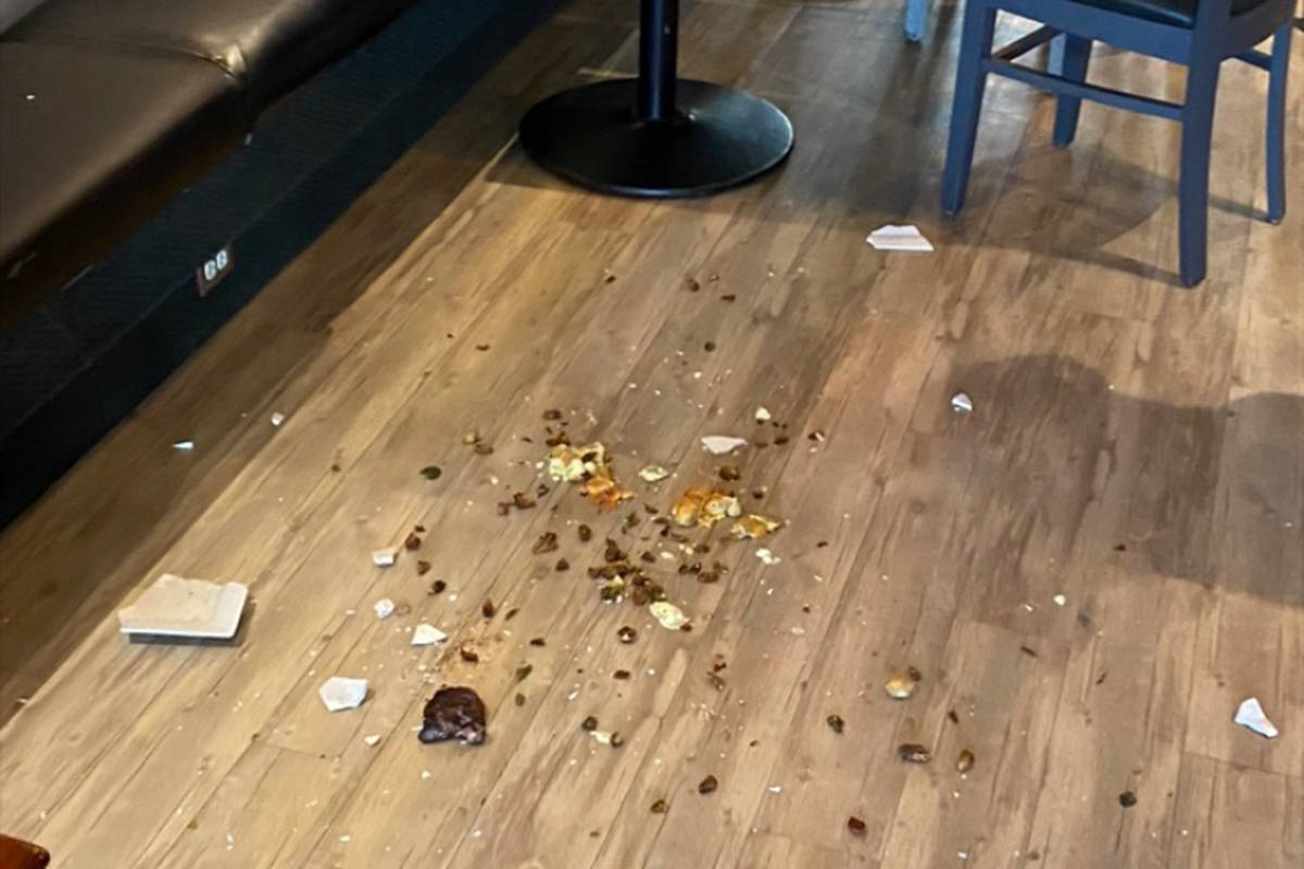 The aftermath of a violent incident at Mittz Kitchen on July 4, when a customer pushed owner Steve Mitton over a table and smashed a plate of food on the floor over being asked to follow COVID-19 safety protocols. (Kamloops This Week)