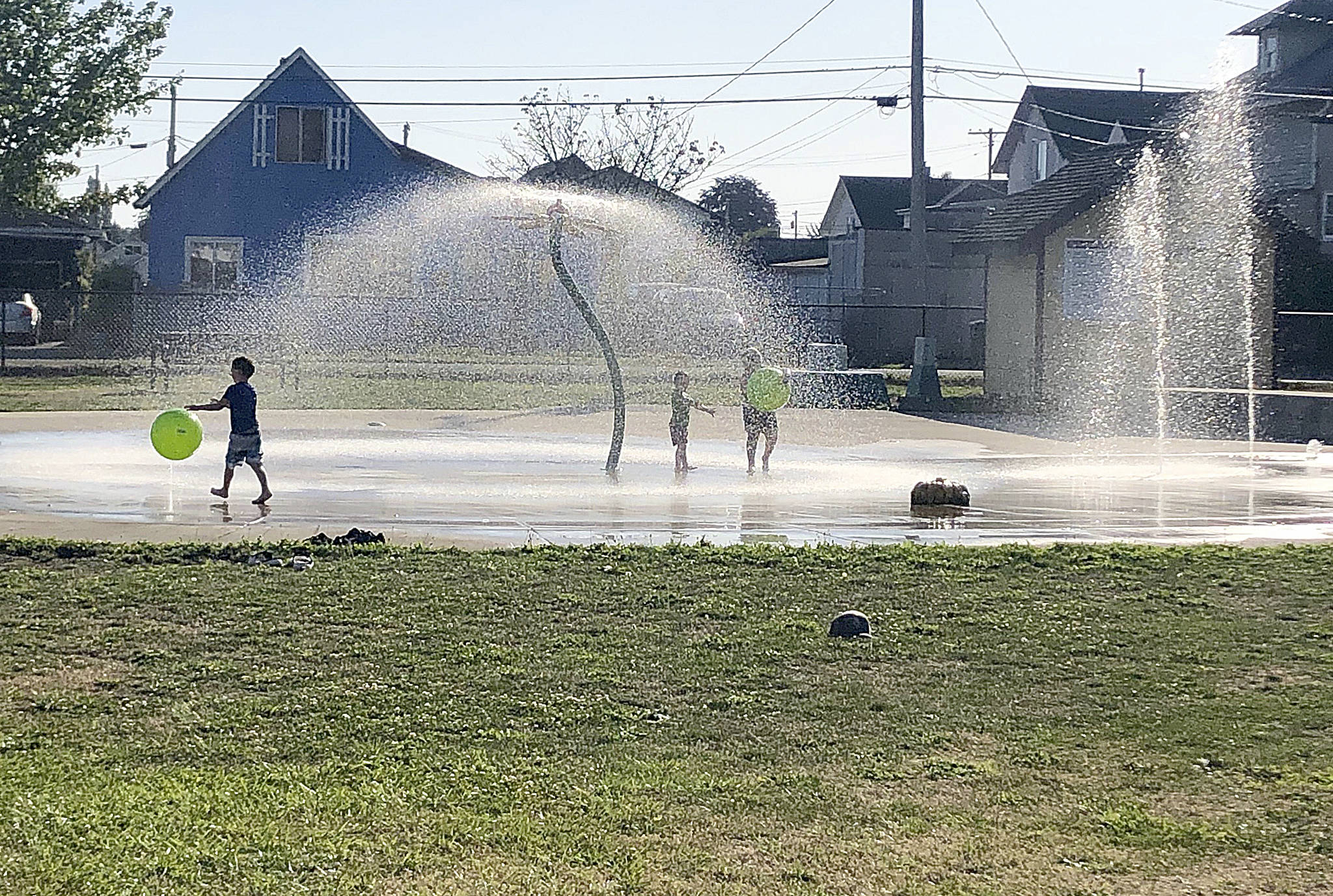 DENISE BURKE PHOTO Reader Denise Burke of Hoquiam snapped this shot of youngsters enjoying the spray park at Art Pocklington Central Play Park in Hoquiam on one of the last days before school started.