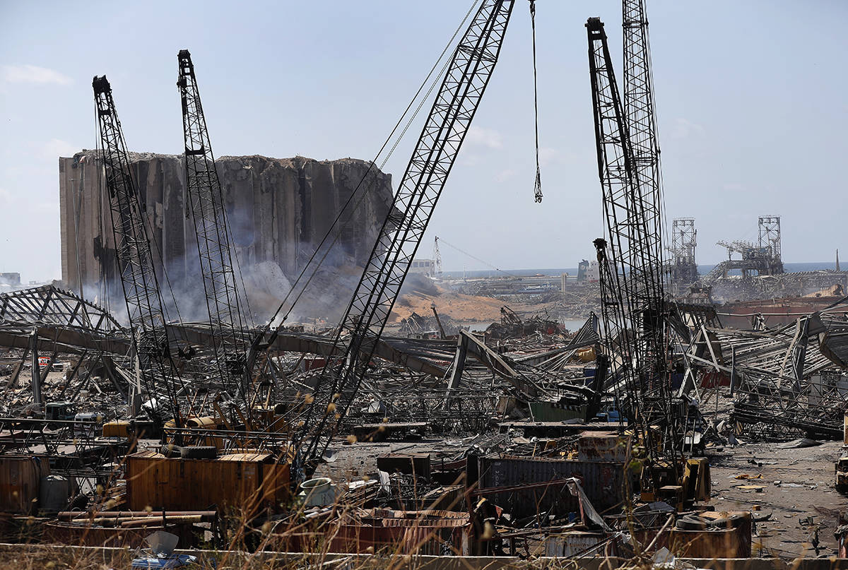 Extensive damage shows at the site of an explosion that hit the seaport of Beirut, Lebanon, Wednesday, Aug. 5, 2020. Residents of Beirut stunned, sleepless and stoic emerged Wednesday from the aftermath of a catastrophic explosion searching for missing relatives, bandaging their wounds and retrieving what’s left of their homes. (AP Photo/Hussein Malla)
