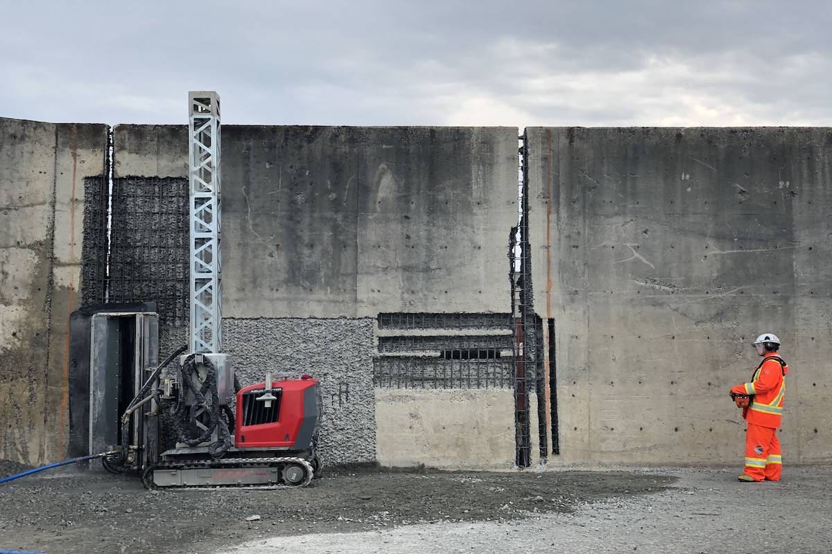 An operator maneuvers a hydro-demolition robot at Discovery Parks, Campbell River. Photo by Binny Paul/ Campbell River Mirror.