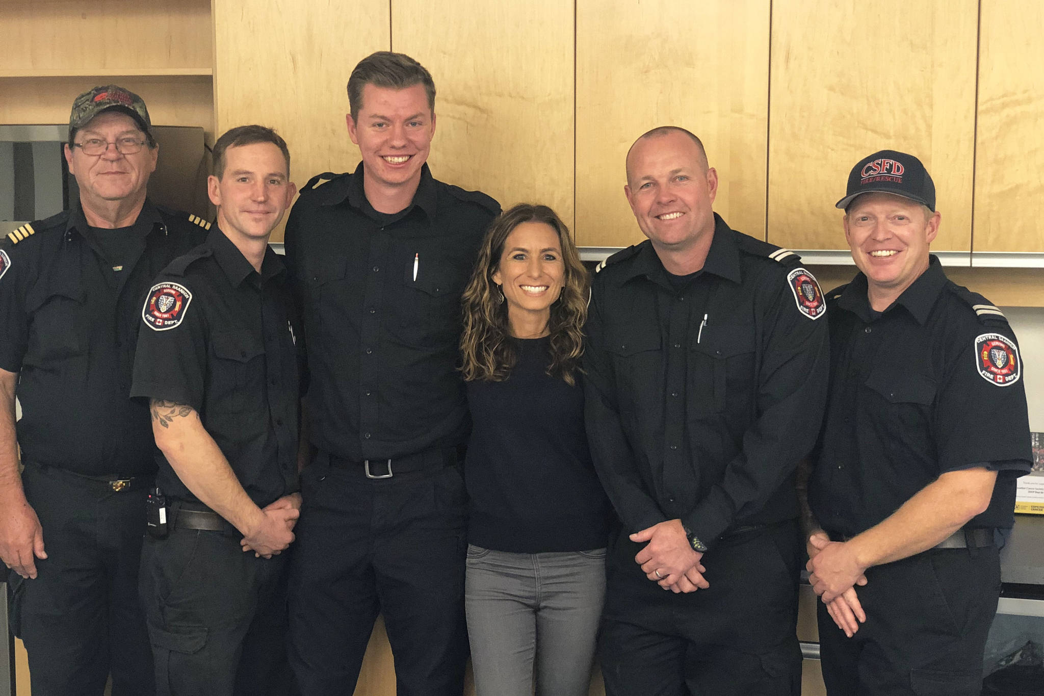 Jen Klein thanks Central Saanich firefighters for helping her after a crash on Highway 17 in July 2019. (Photo contributed by Jen Klein)