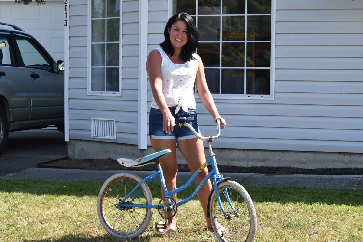 Corrina Mahoney displays the bike she won on Canada Day at Lewis Park when she was six years old. Scott Stanfield photo