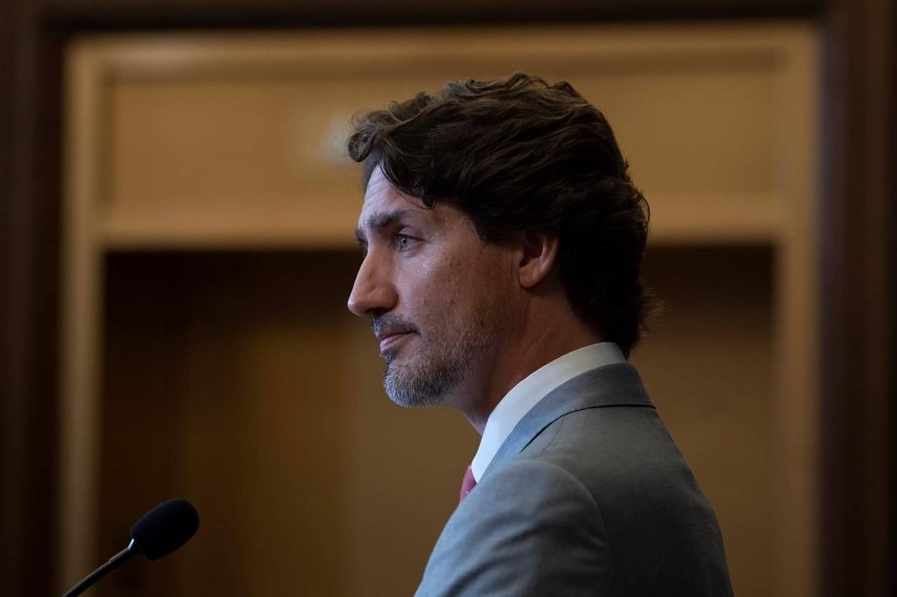 Prime Minister Justin Trudeau listens to a question during a news conference on parliament hill in Ottawa, Tuesday, Aug. 18, 2020. THE CANADIAN PRESS/Adrian Wyld