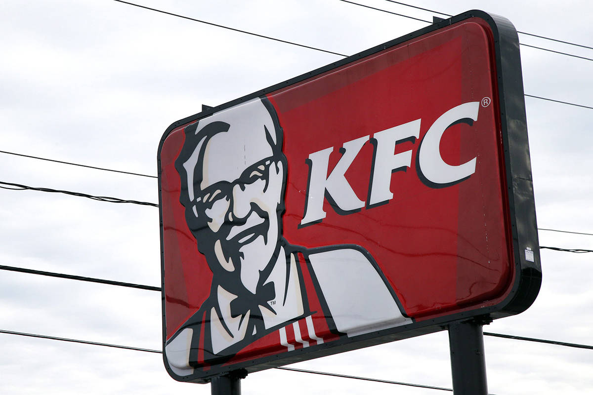FILE In this Jan. 31, 2014 file photo, a KFC sign hangs in Saugus, Mass. (AP Photo/Elise Amendola, File)