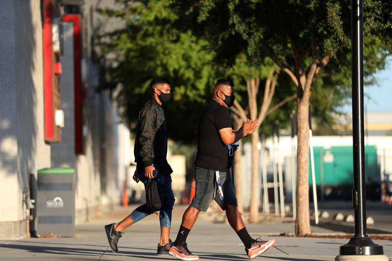 Members of the San Jose Earthquakes depart the stadium where the team had been scheduled to play the Portland Timbers in an MLS soccer match in San Jose, Calif., Wednesday, Aug. 26, 2020. Major League Soccer players boycotted five games Wednesday night in a collective statement against racial injustice. The players’ action came after all three NBA playoff games were called off in a protest over the police shooting of Jacob Blake in Wisconsin on Sunday night.