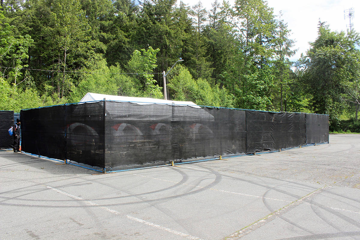 Security checks in at the Fuller Lake Arena parking lot homeless tenting site, a stopgap measure during COVID. (Photo by Don Bodger)