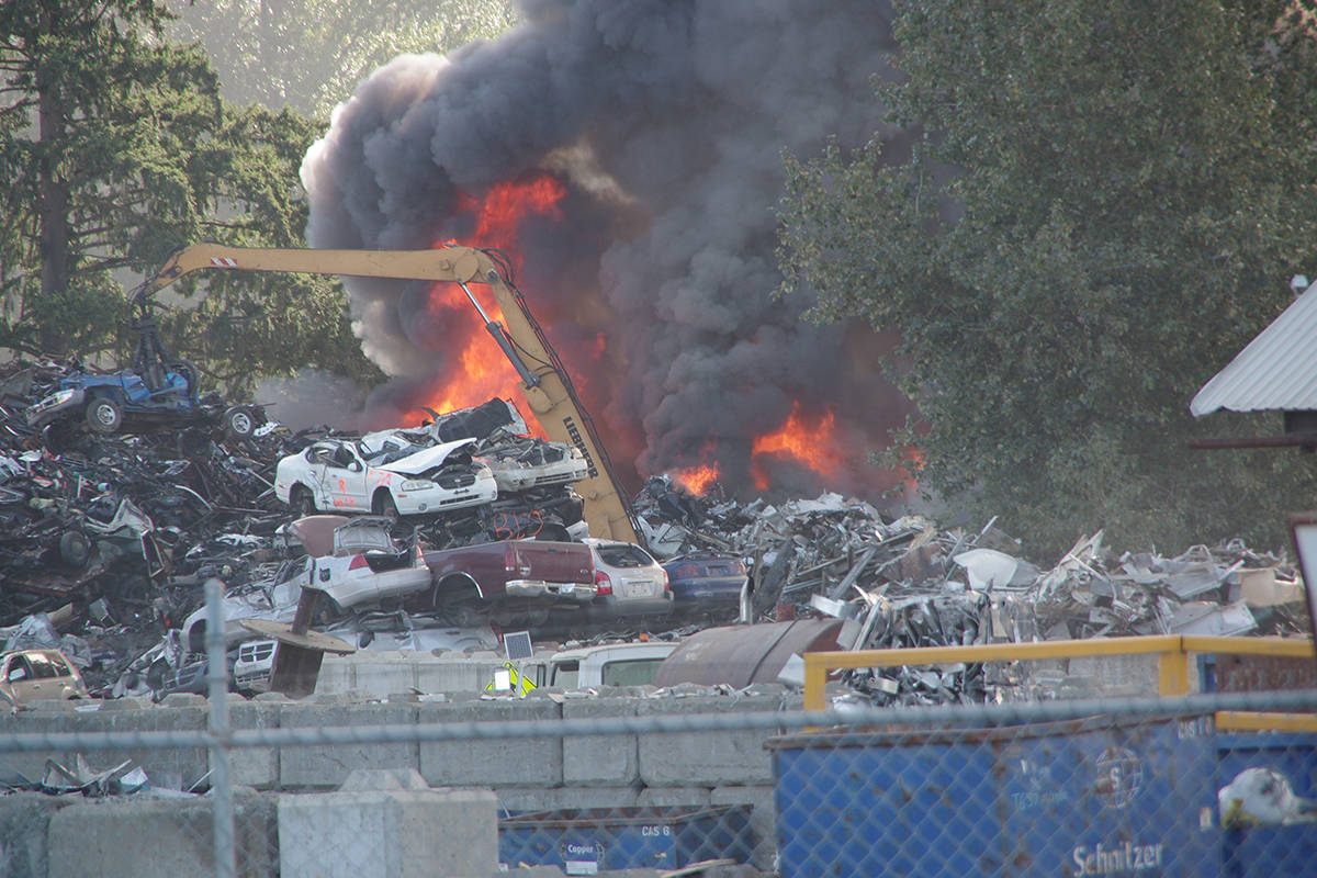More than 70 firefighters are battling a blaze at Schnitzer Steel Canada’s facility near Nanaimo Airport, according to the Cowichan Valley Regional District. (Chris Bush/Black Press)