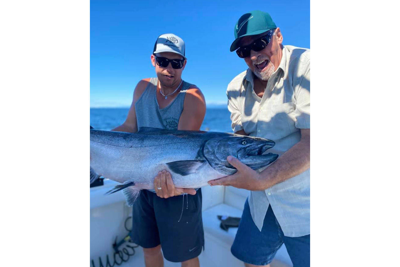 Wayne Jackson (right) latched onto “the big one” - a chinook salmon weighed in at more than 60 pounds. Photo submitted