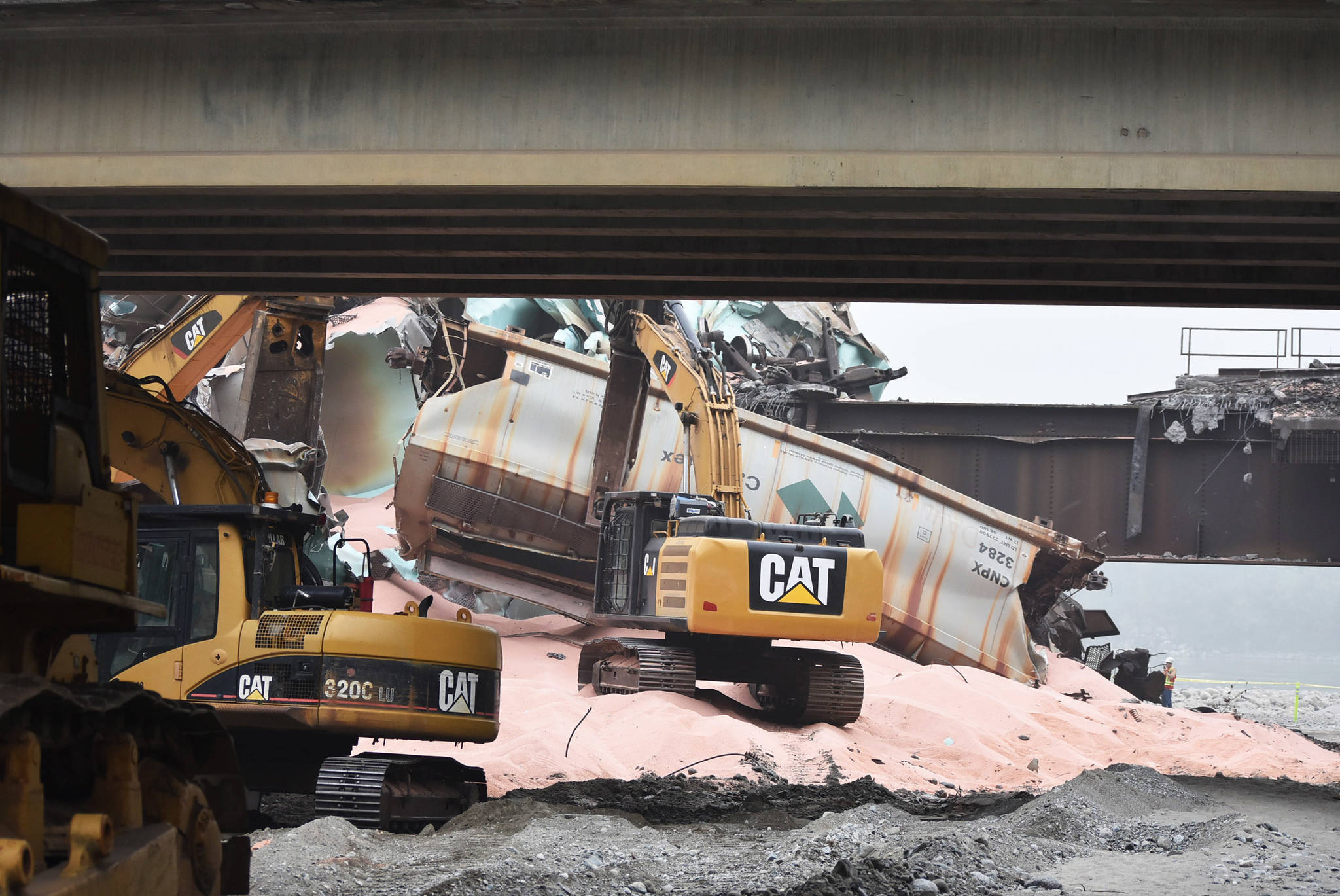 Heavy machinery was used to dismantle and moved the wreckage from approximately 60 rail cars involved in a crash Sept. 14. (Emelie Peacock/Hope Standard)