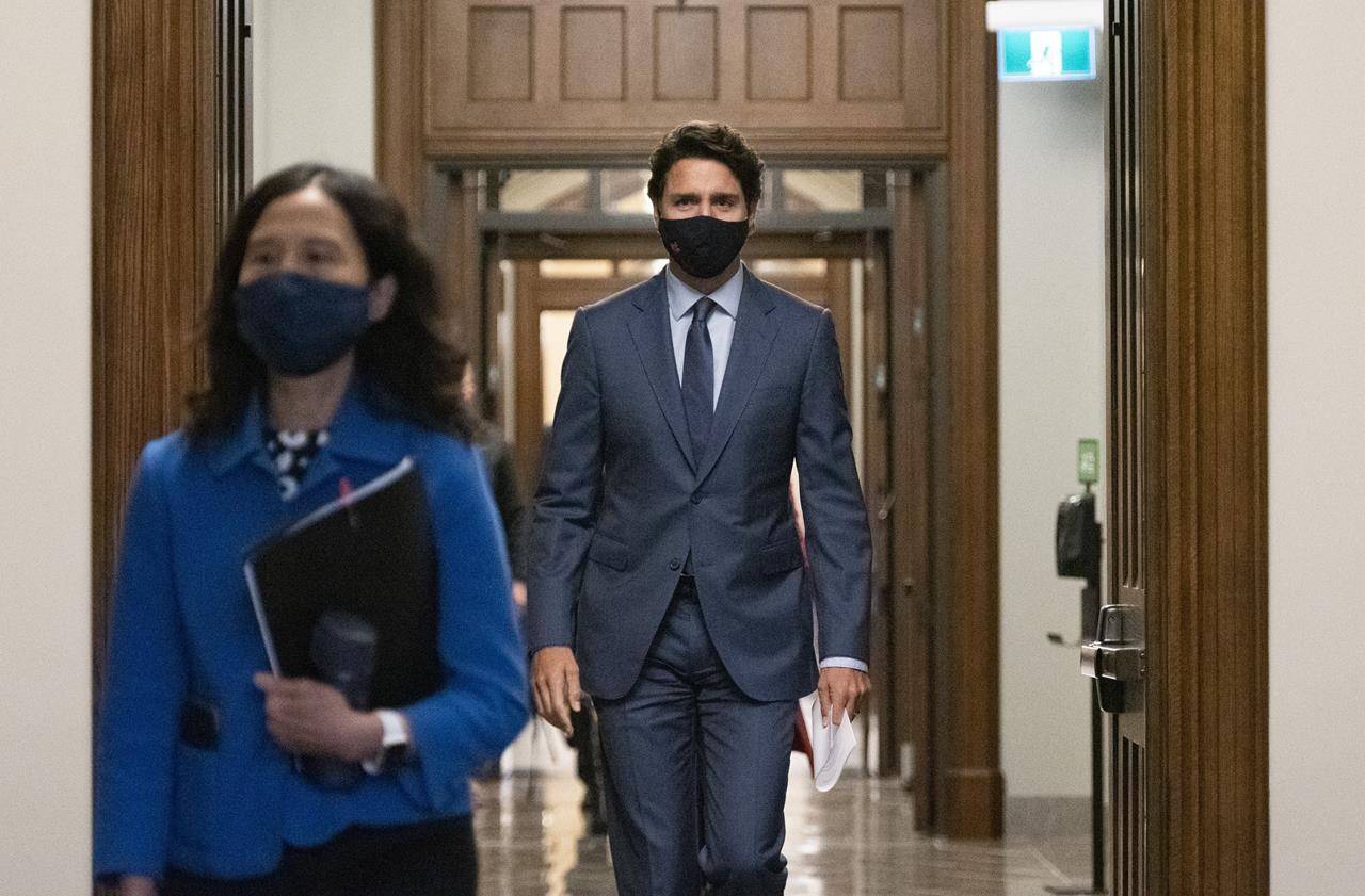 Prime Minister Justin Trudeau arrives with Chief Public Health Officer of Canada Dr. Theresa Tam, left, for a news conference on the COVID-19 pandemic on Parliament Hill in Ottawa, on Friday, Sept. 25, 2020. THE CANADIAN PRESS/Justin Tang