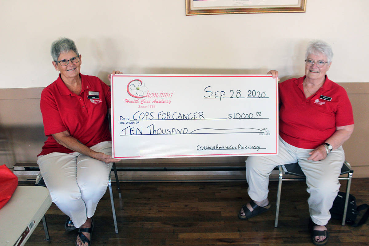 Chemainus Health Care Auxiliary’s Diana Lenihan, left, and Nancy Southern with a $10,000 cheque for the Cops For Cancer Tour de Rock campaign. (Photo by Don Bodger)