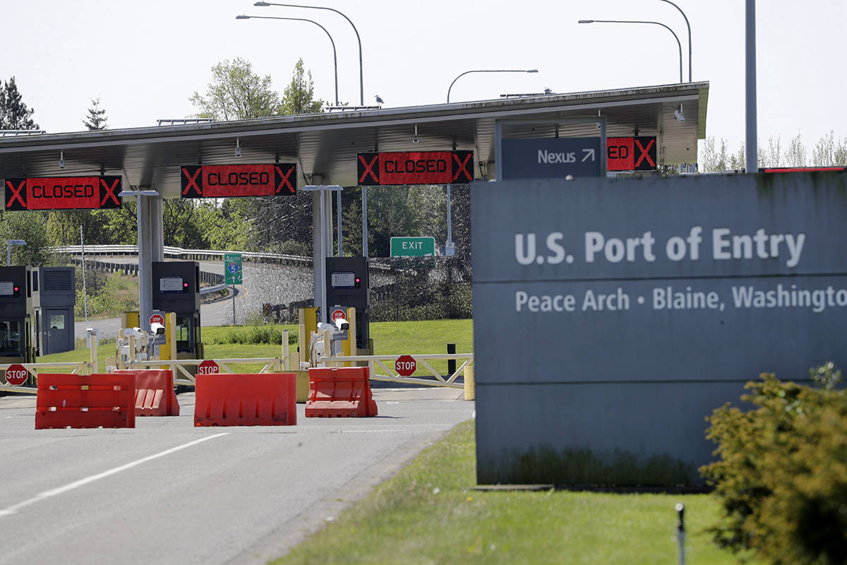Most lanes remain closed at the Peace Arch border crossing into the U.S. from Canada, where the shared border has been closed for nonessential travel in an effort to prevent the spread of the coronavirus, Thursday, May 7, 2020, in Blaine, Wash. The restrictions at the border took effect March 21, while allowing trade and other travel deemed essential to continue. (AP Photo/Elaine Thompson)