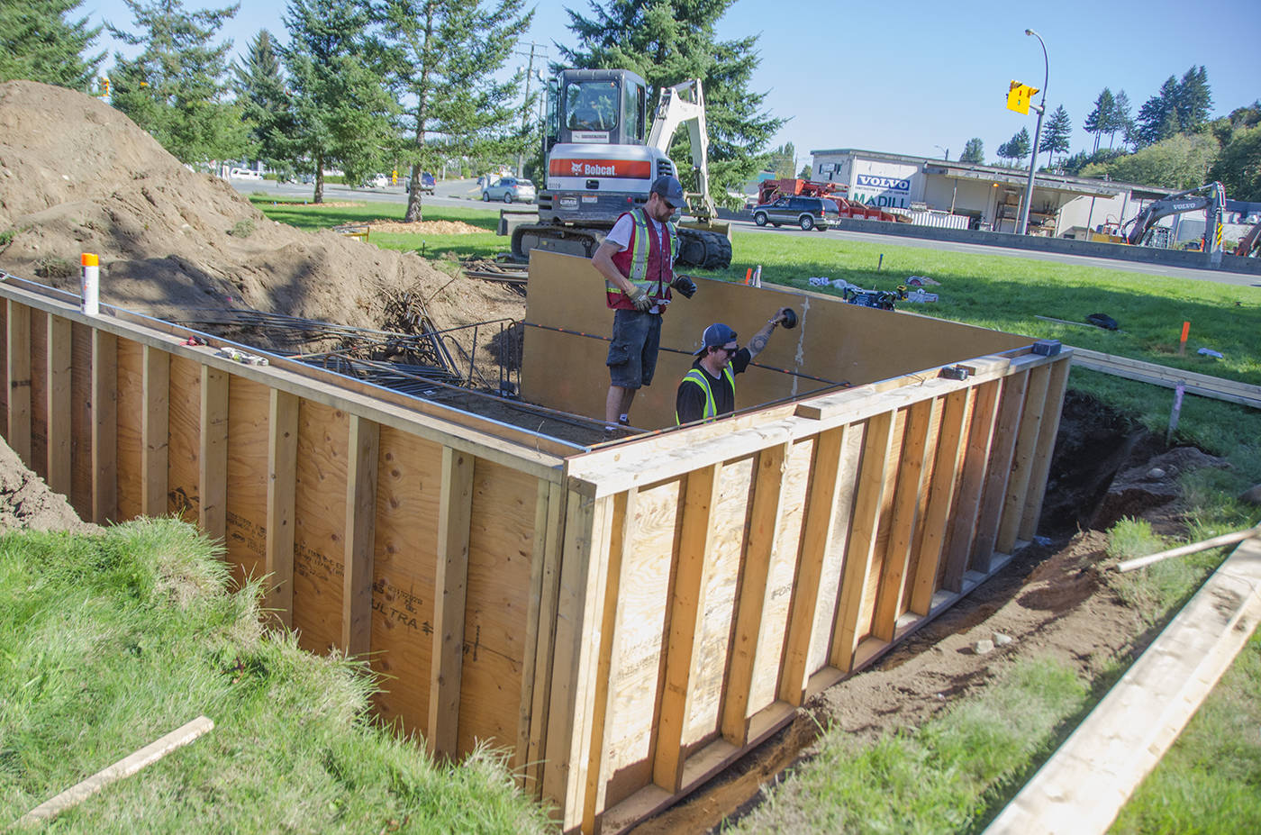 A crew from Seymour Pacific works on installing rebar into the foundation form for the entrance feature on the grassy meridian entering Campbellton as construction gets underway. The foundation will hold a 25-foot pedestal with a Beaver floatplane perched on top. Photo by Mike Davies/Campbell River Mirror