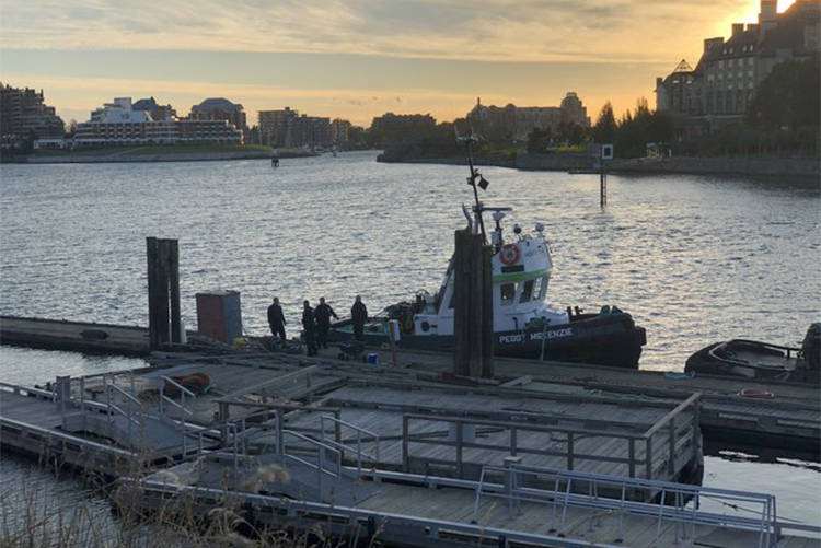 VicPD officers at the Johnson Street bridge for a report of a person in the water on Oct. 14. (Nina Grossman/News Staff)