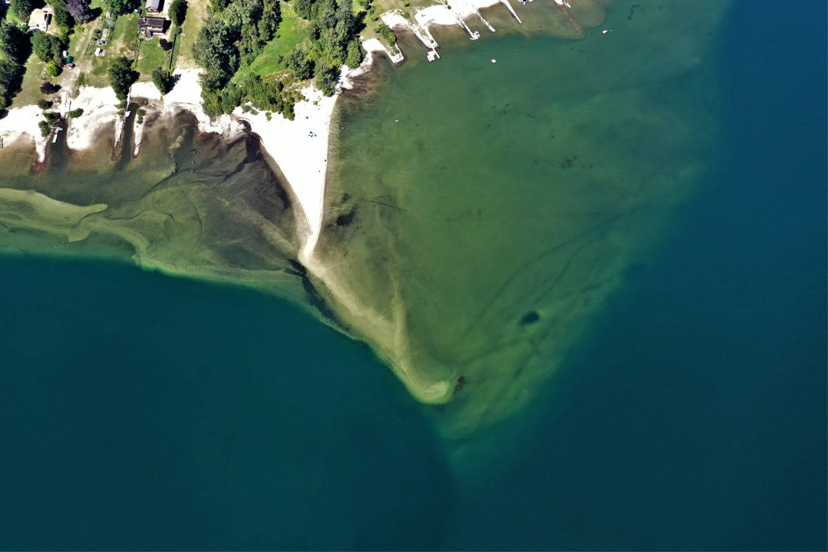 Six Mile Beach outside Nelson is known for its perfect sand, clear water and unique sand spit. But the drowning death of a man in July has residents asking if the dangerous spot has become too popular. Photo: David Grantham/Kootenay Drone Services