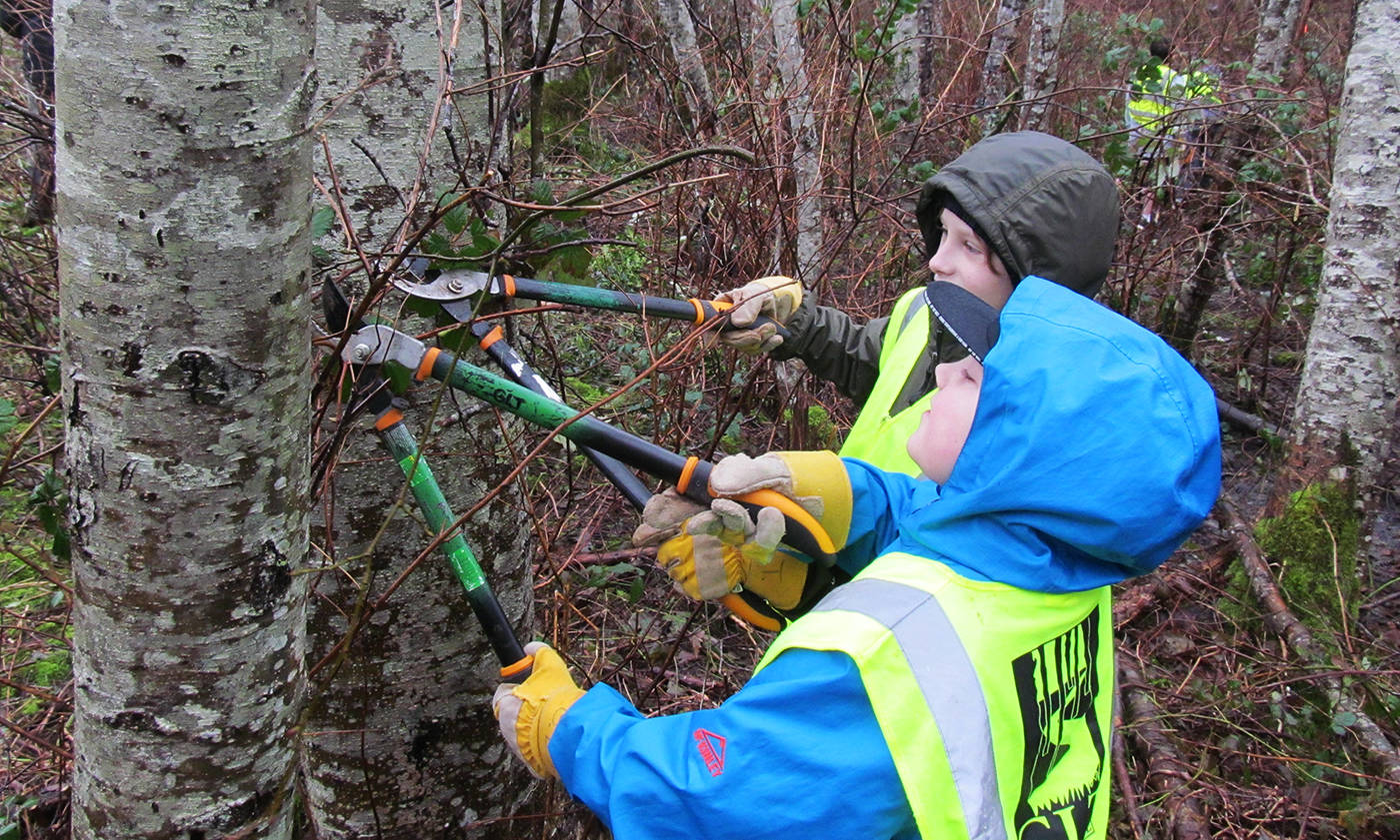 A pair of students take part in the Greenways Land Trust Junior Streamkeeper program last year. Photo supplied by Greenways Land Trust