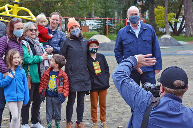 B.C. NDP leader John Horgan poses with members of the public during a ‘mainstreeting’ campaign stop Sunday, Oct. 18, at Parksville Community Park. (Peter McCully/Black Press)